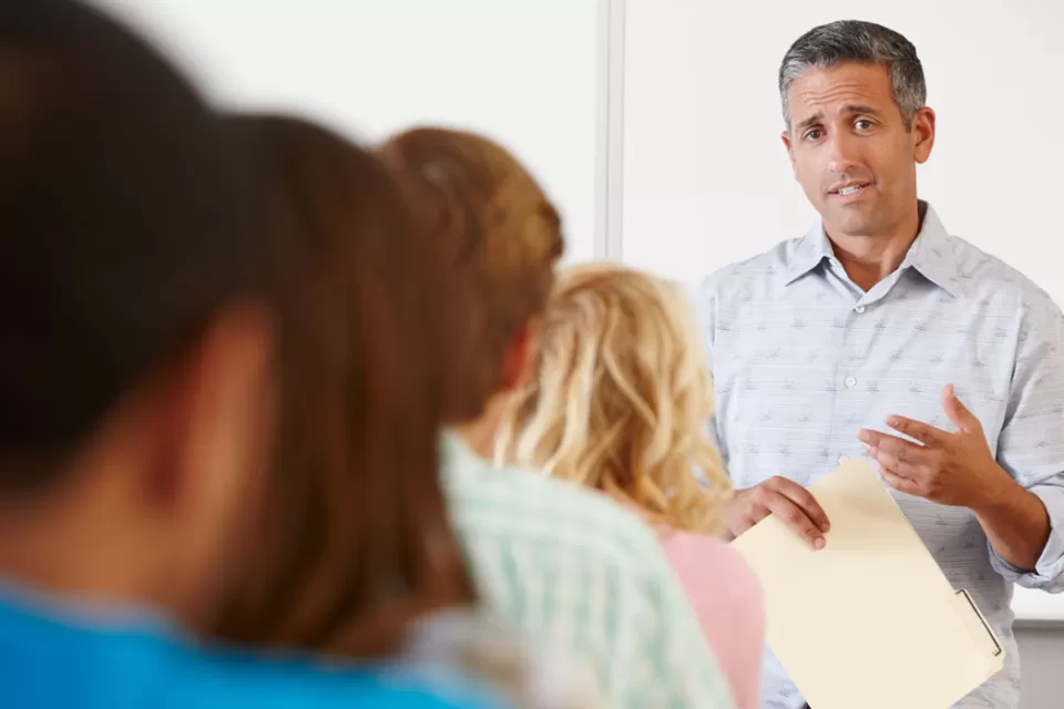 Tutor with class of students